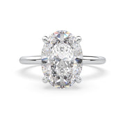 an oval cut diamond ring with a center stone