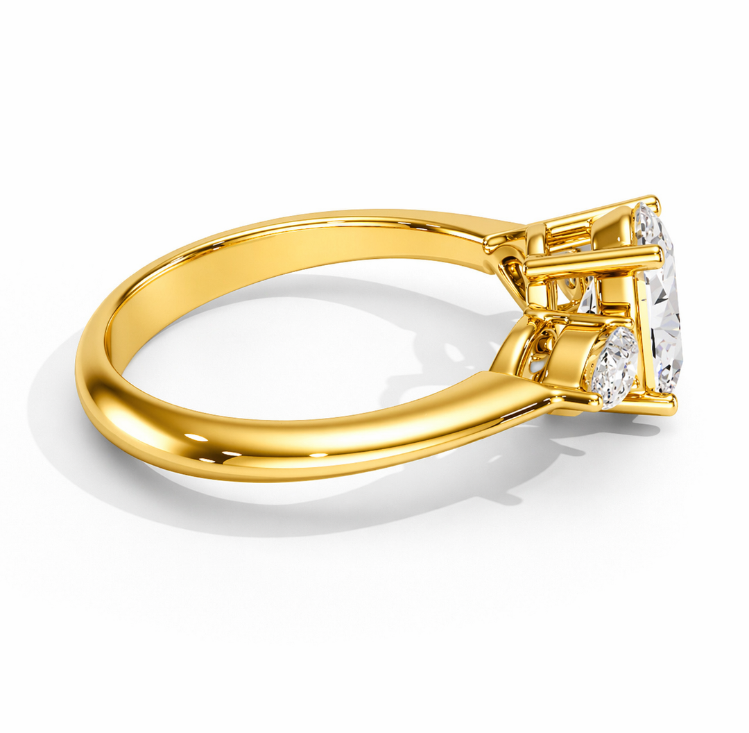     Yellow gold three stone oval natural diamond ring with pear side diamonds, side view showcasing the oval center diamond and setting