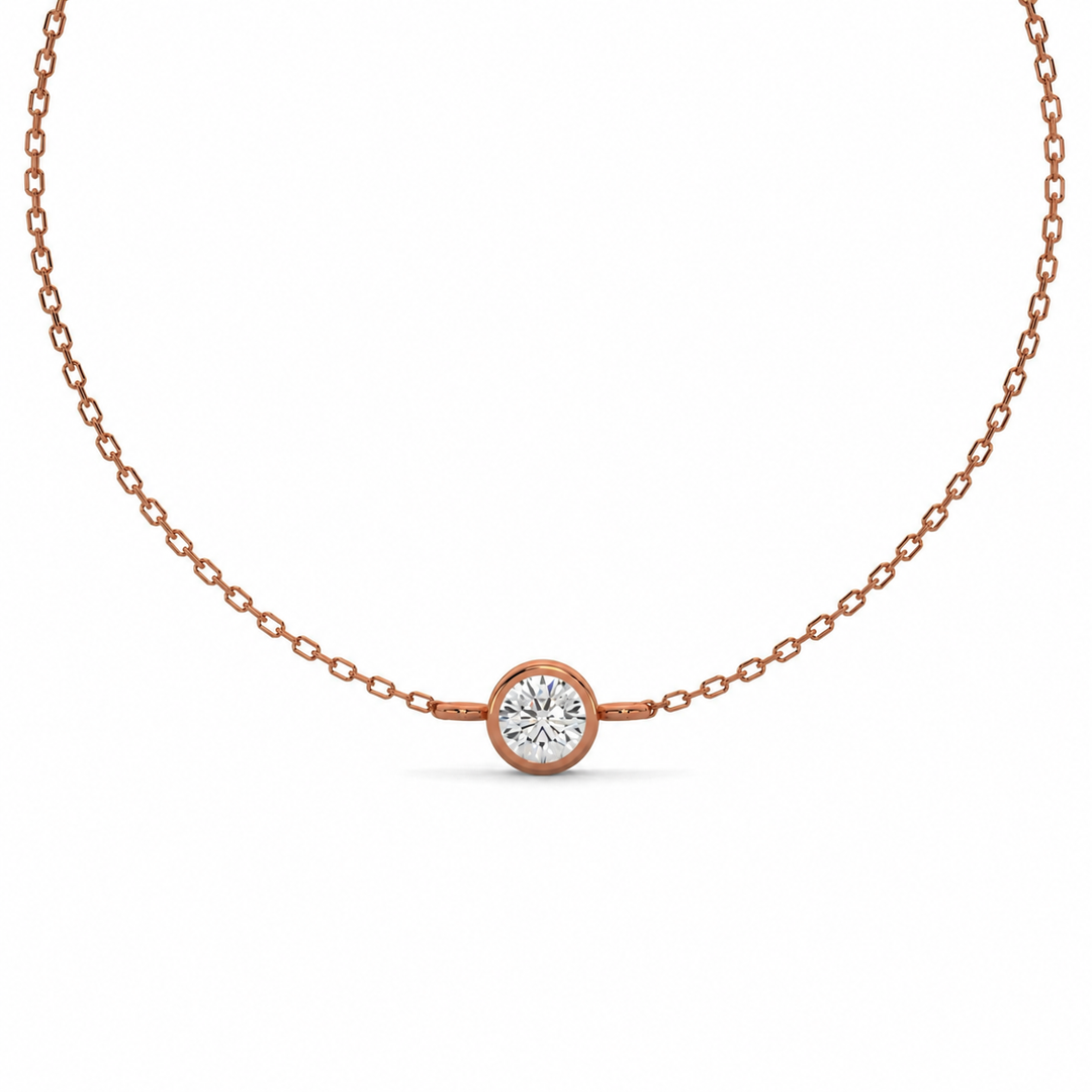     Round bezel lab-grown diamond bracelet in rose gold on a white background.