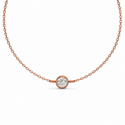     Round bezel lab-grown diamond bracelet in rose gold on a white background.