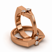 Different Love one-of-a-kind ring in rose gold with two round lab-grown diamond accents and a sculptural open structure inspired by love

