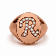Rose gold initial signet ring featuring the letter R set with natural round-cut diamonds, front view render.