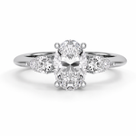 Load image into Gallery viewer,     White gold lab-grown oval three stone diamond ring with pear side diamonds, front view featuring the oval center stone