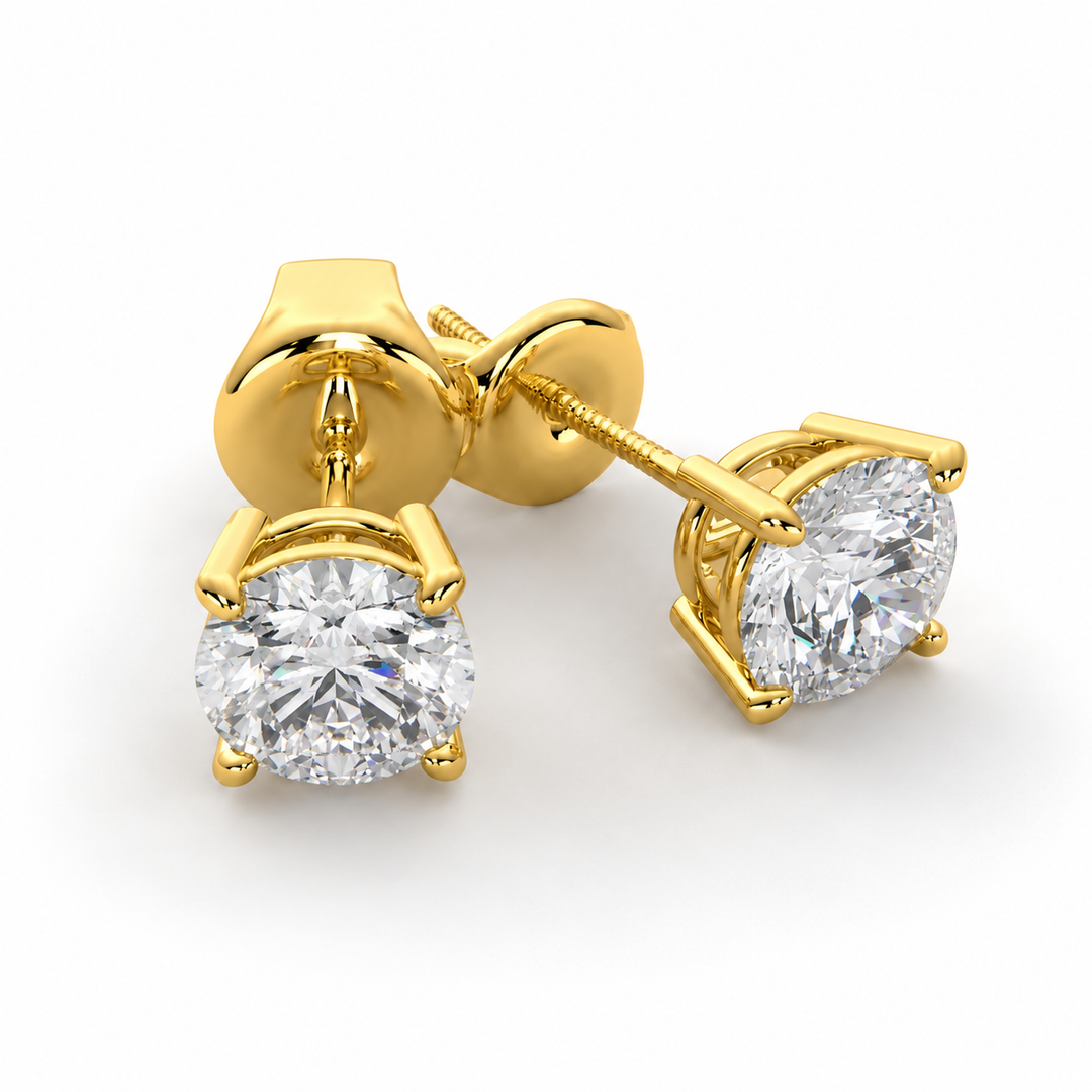Lab-grown round diamond stud earrings in polished 14K yellow gold with secure four-prong settings.