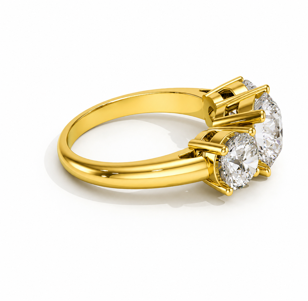Three-stone round lab-grown diamond ring in yellow gold, side view
