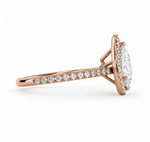 Load image into Gallery viewer, Side view of a lab-grown pear halo diamond ring in 14K rose gold with a pavé diamond band.