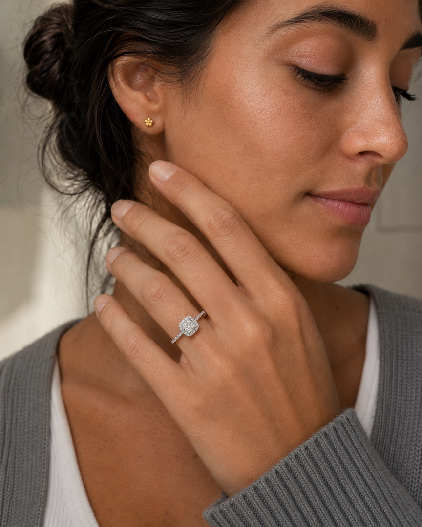     Woman wearing a cushion halo lab-grown diamond engagement ring in white gold.