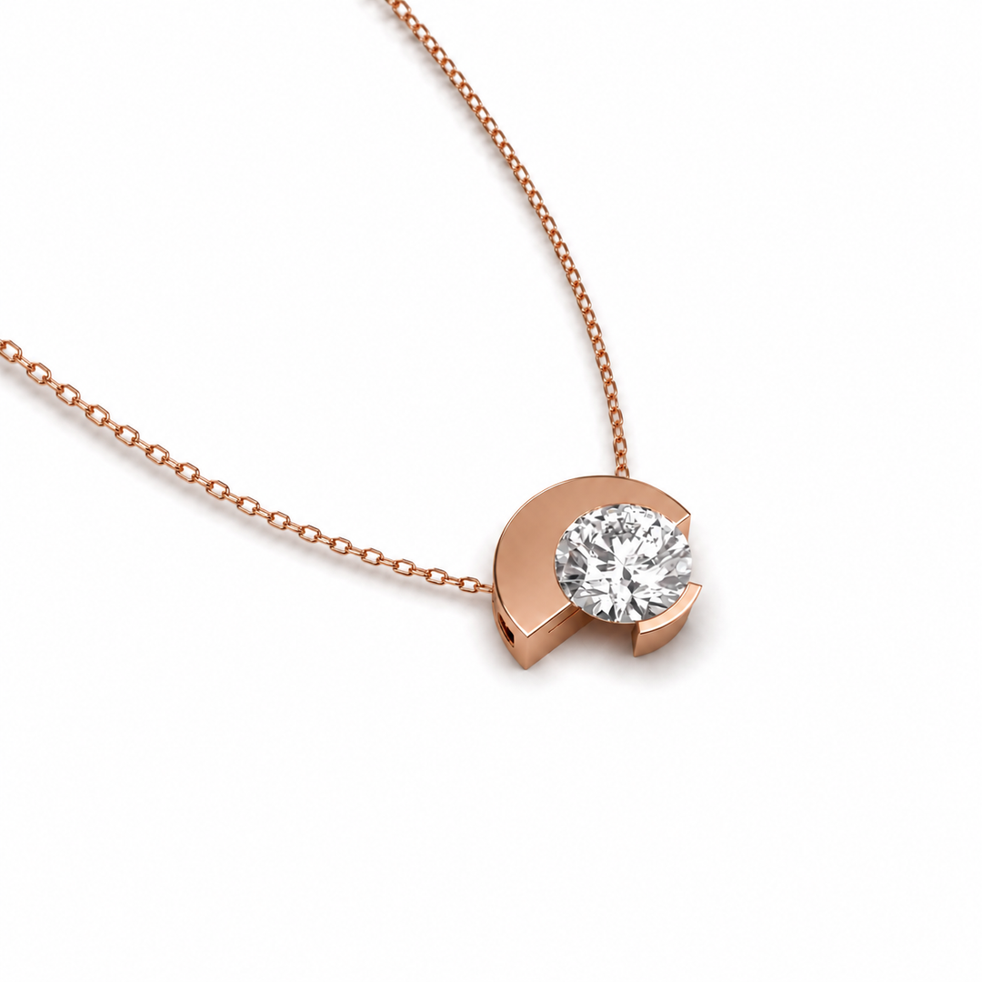 Asymmetric round natural diamond necklace in rose gold, clean contemporary look, angled view