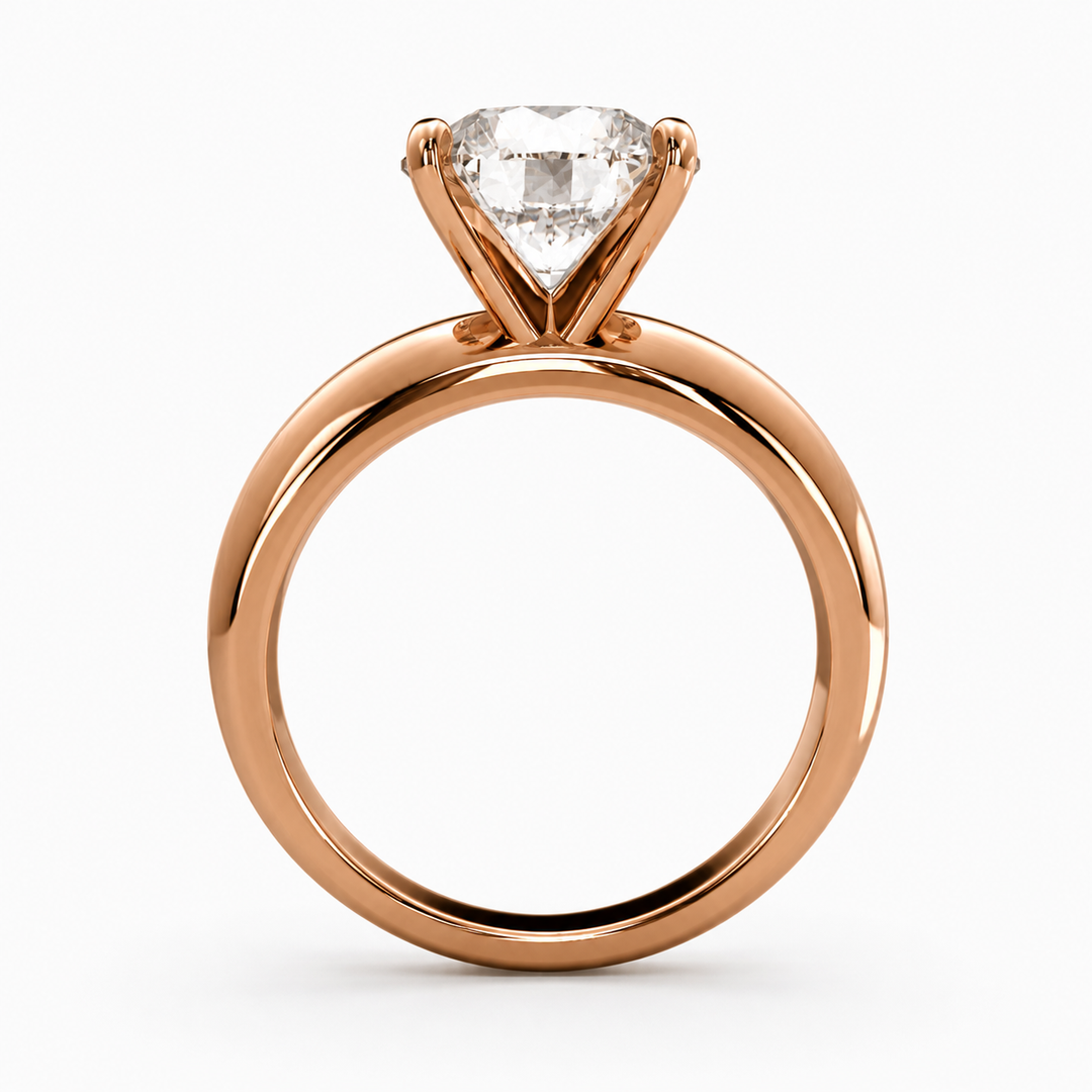 Round lab grown diamond solitaire ring in rose gold, side profile showing band and prong structure