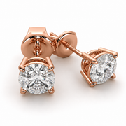 Natural round diamond stud earrings in 14K rose gold with a classic four-prong solitaire setting.