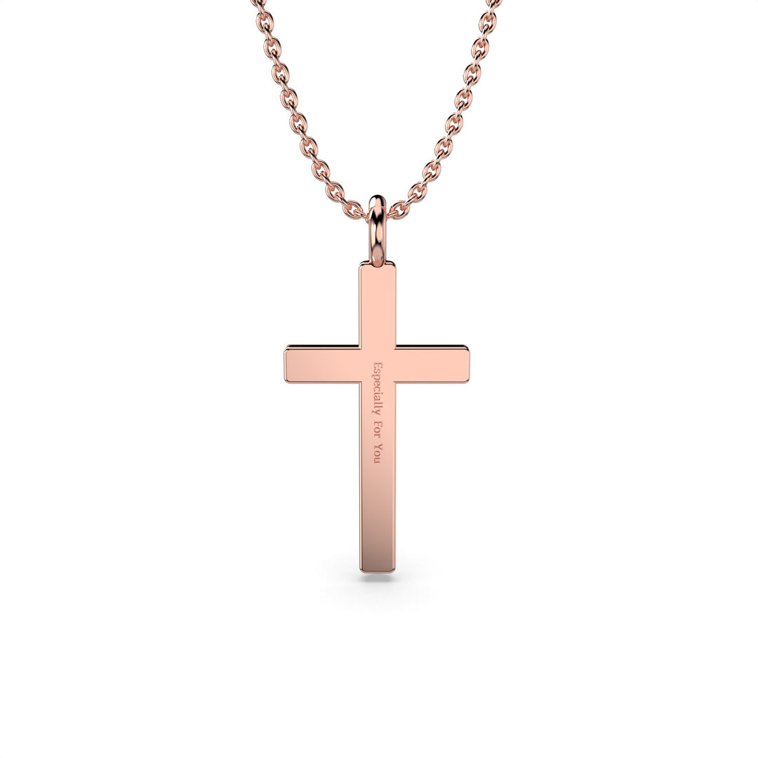 Back view of a rose gold cross pendant on a chain