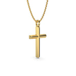 Load image into Gallery viewer, Gold cross necklace on a chain shown at a slight angle