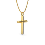 Yellow gold cross necklace on a chain shown at a slight angle