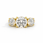 Load image into Gallery viewer, Three-stone round lab-grown diamond ring in yellow gold, front view, featuring a larger center diamond with two round side diamonds