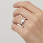 Load image into Gallery viewer, Lab-grown oval diamond three-stone engagement ring on hand