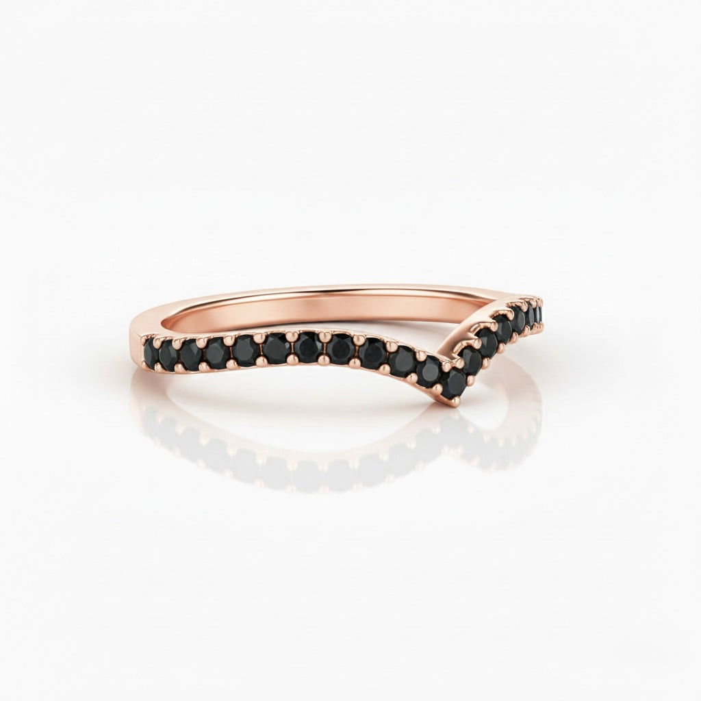 Side view of black diamond V-shaped ring in rose gold, curved pavé band with black diamonds