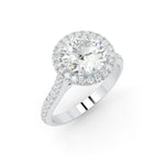 Load image into Gallery viewer, Angled side view of a lab-grown round diamond halo ring in white gold, highlighting the setting and side diamonds