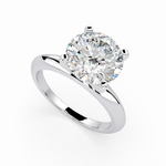 Load image into Gallery viewer, Round lab grown diamond solitaire ring in white gold, angled view showing classic prong setting
