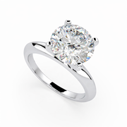 Round lab grown diamond solitaire ring in white gold, angled view showing classic prong setting
