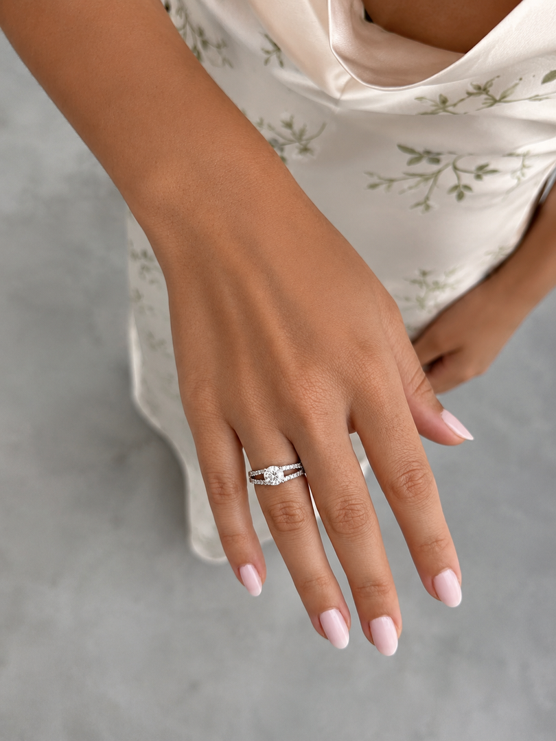 Round cut lab grown diamond engagement ring with a split shank design, set in rose gold, shown 