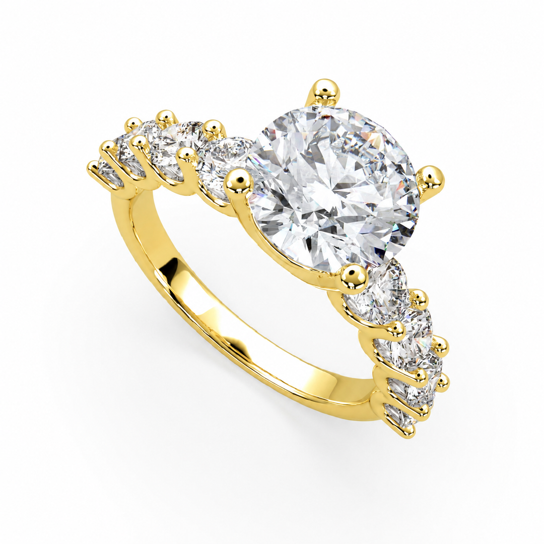 Ericiera round natural diamond ring in yellow gold with a round brilliant center diamond and graduated side diamonds, angled front view.