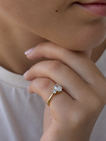 Load image into Gallery viewer, Three-stone oval diamond engagement ring on hand with natural oval diamonds