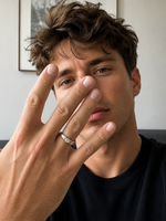 Load image into Gallery viewer, Close-up of a man wearing a Statement Natural Diamond Solitaire Ring in white gold with a brilliant round natural diamond and sleek contemporary design