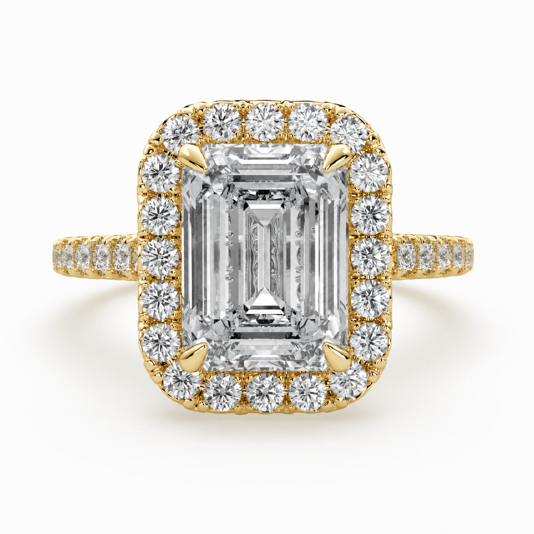     Front view of a lab-grown emerald-cut diamond halo ring in yellow gold with pavé side diamonds