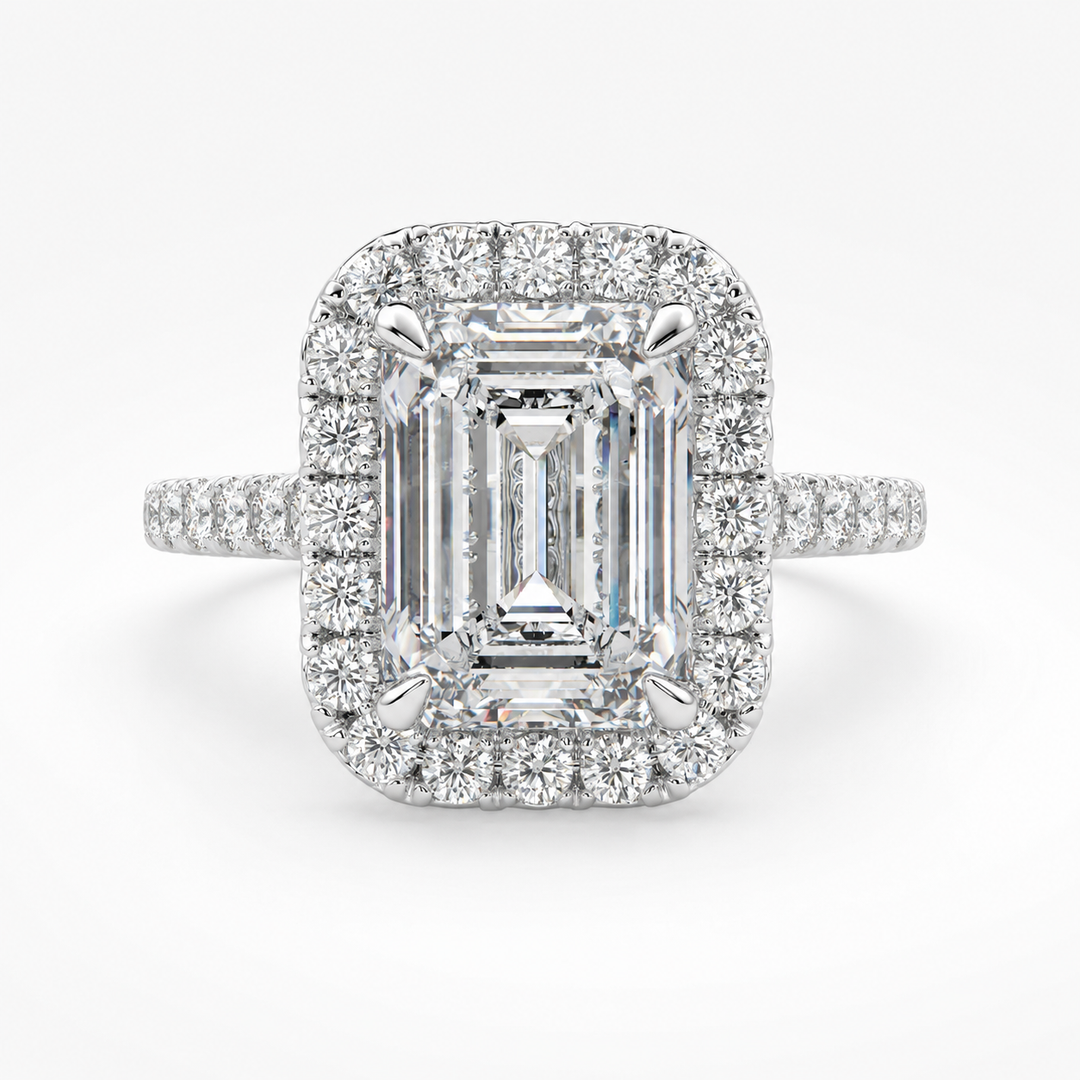 Natural emerald-cut diamond halo ring in white gold, front view, with round diamond halo and pavé side diamonds