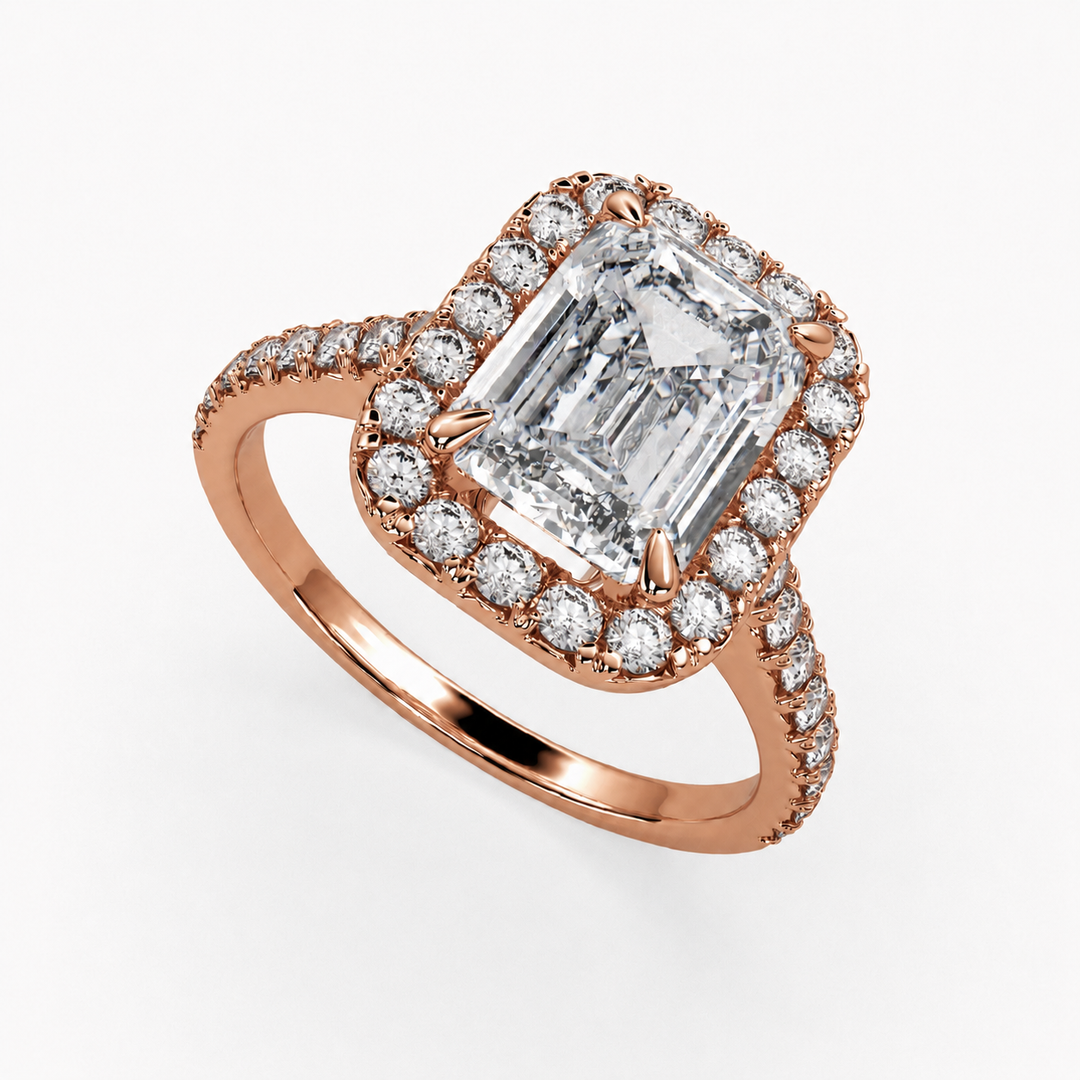     Lab-grown emerald-cut diamond halo ring in rose gold, three-quarter view with diamond-set band
