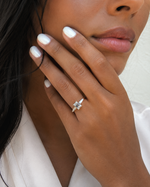 Load image into Gallery viewer, Natural emerald cut diamond ring with tapered side stones in yellow gold – lifestyle hand view