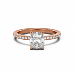 Load image into Gallery viewer, Rose gold cushion-cut natural diamond solitaire engagement ring with a pavé diamond band on a white background.