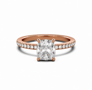 Rose gold cushion-cut natural diamond solitaire engagement ring with a pavé diamond band on a white background.