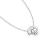 Asymmetry lab-grown diamond pendant necklace laying on side, profile view