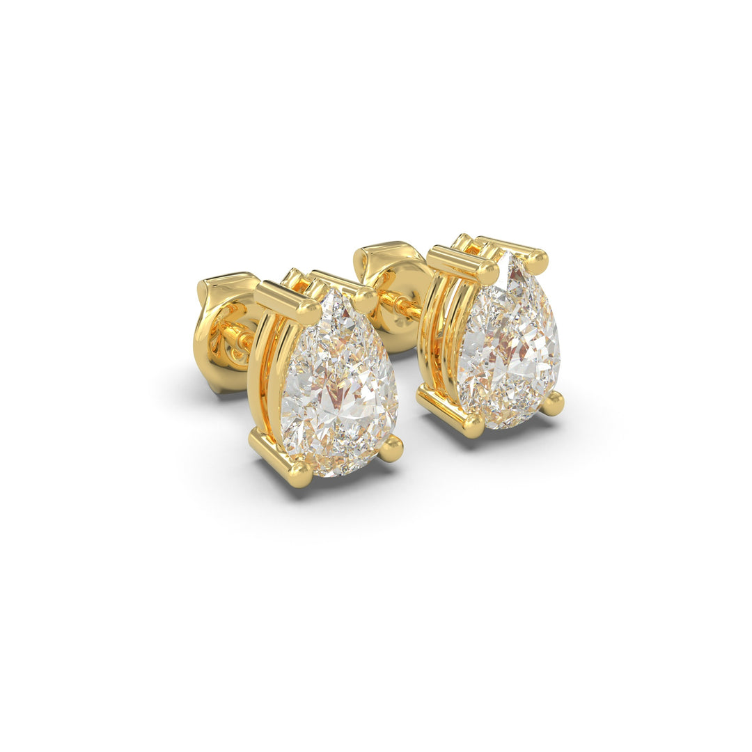 Side view of natural pear cut diamond stud earrings set in yellow gold