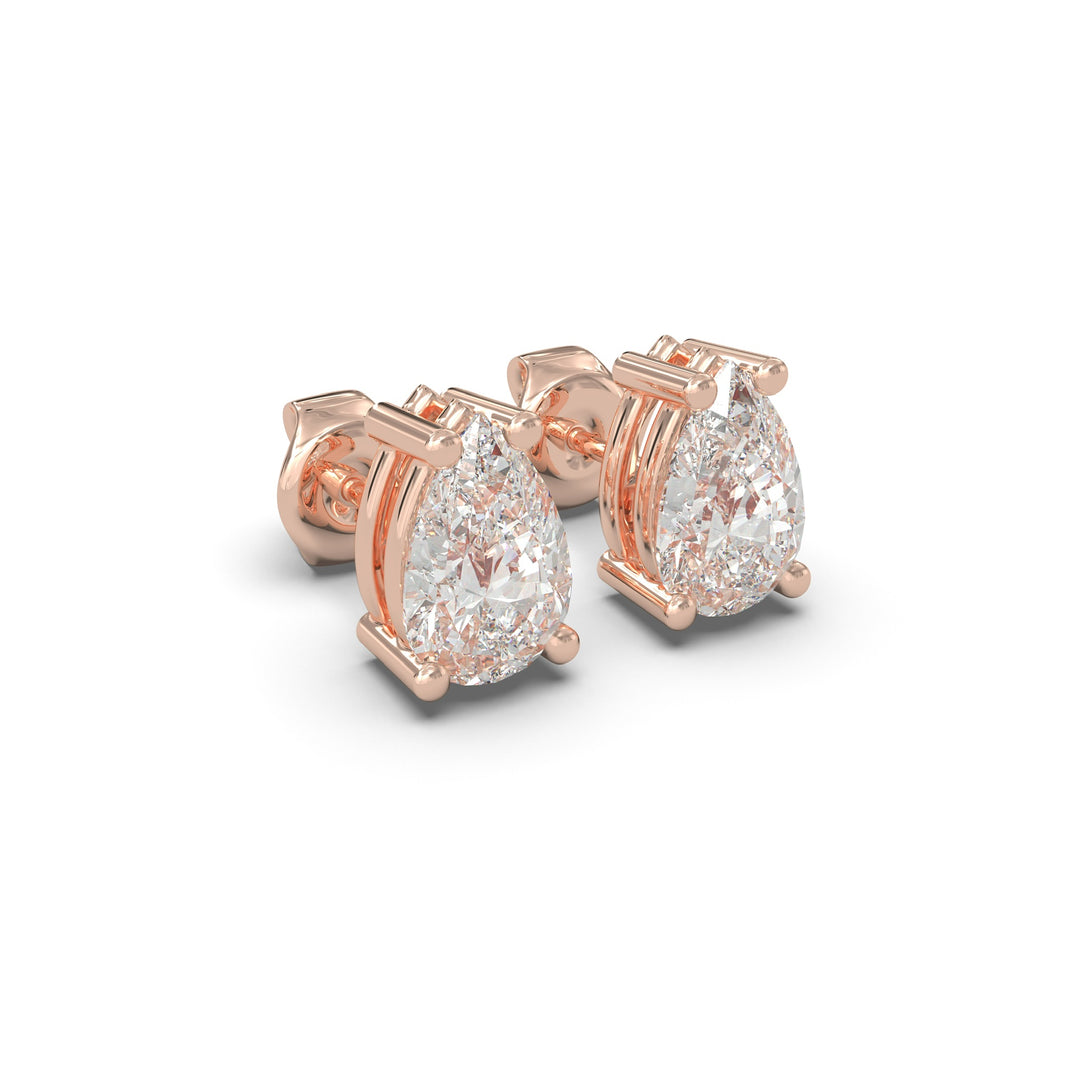 Side view of natural pear cut diamond stud earrings in rose gold