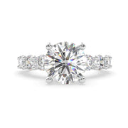 Ericiera round natural diamond ring in 18K white gold with a round center diamond and pavé band, front view.