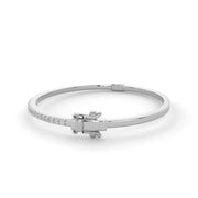 Solid natural diamond bangle bracelet in white gold with round brilliant diamonds, clasp visible