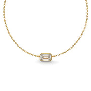 Detailed close-up of an emerald-cut lab-grown diamond bezel bracelet in yellow gold