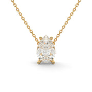 Close-up front view of pear cut natural diamond pendant necklace in yellow gold

