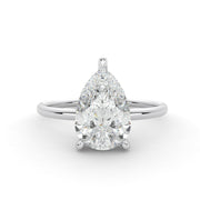 Front-facing view of a pear cut lab grown diamond ring with a hidden halo in white gold

