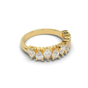 Side view of half eternity natural diamond ring with 9 pear cut diamonds in yellow gold
