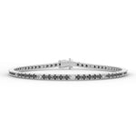 Load image into Gallery viewer, a white gold bracelet with black and white diamonds
