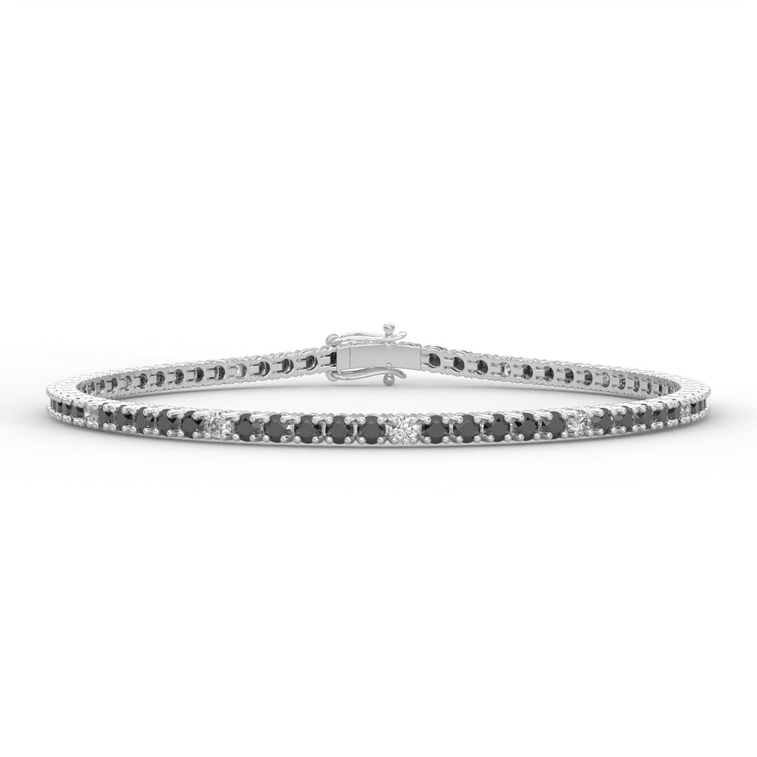 a white gold bracelet with black and white diamonds