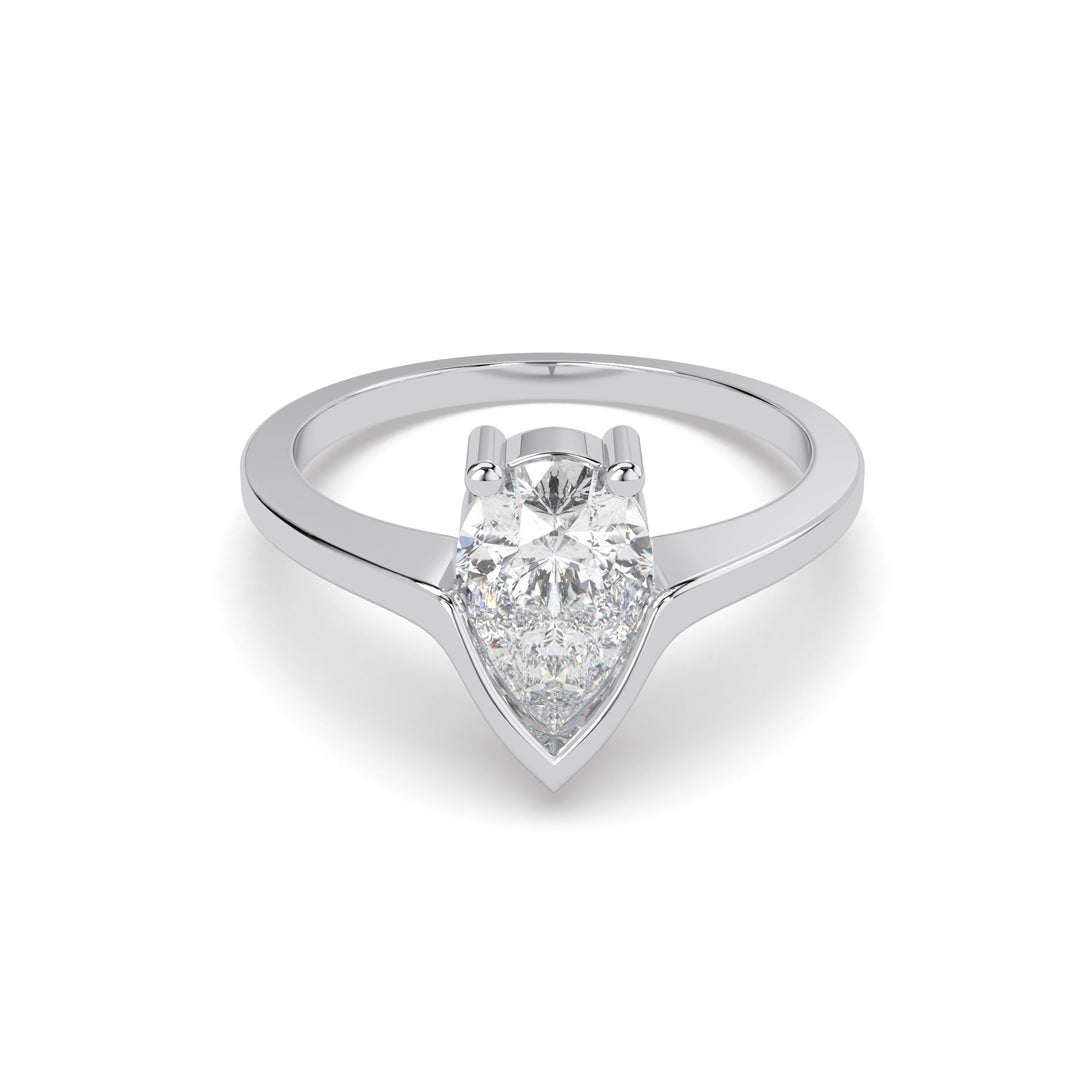a white gold ring with a pear shaped diamond