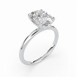Load image into Gallery viewer, a white gold ring with a cushion shaped diamond
