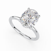 a round cut diamond ring on a white background
